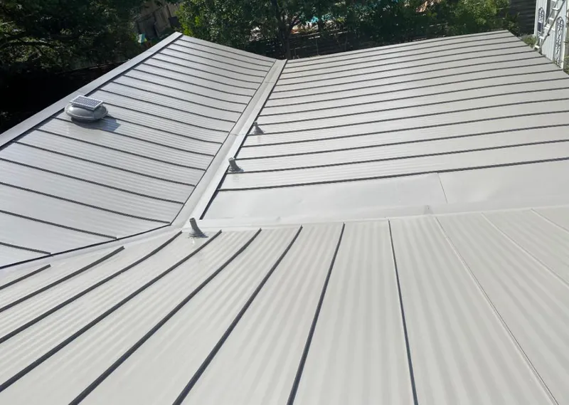 Solar attic fan installed on a metal roof for Roof Ventilation in Van Buren